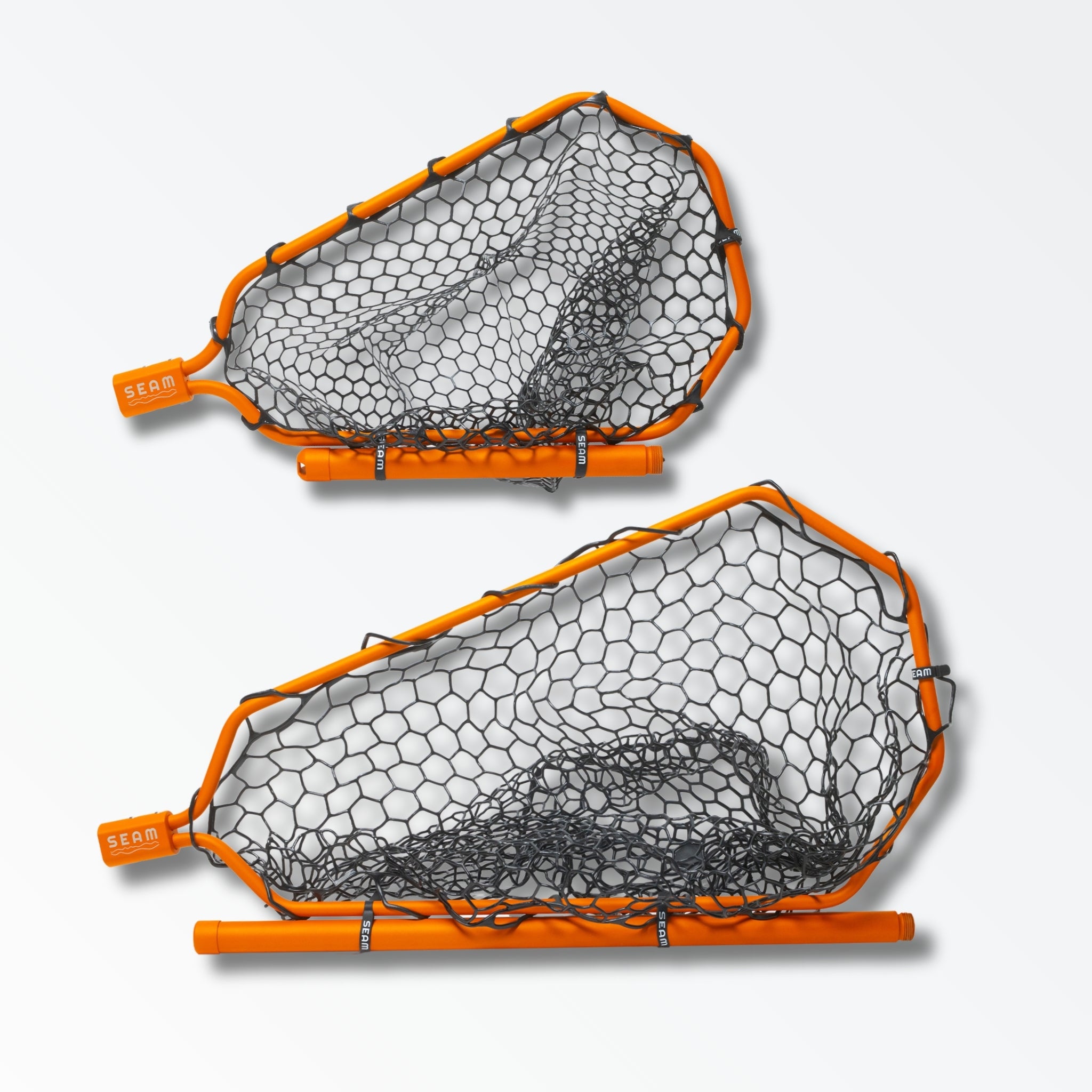 Two different sized orange landing nets for fly fishing