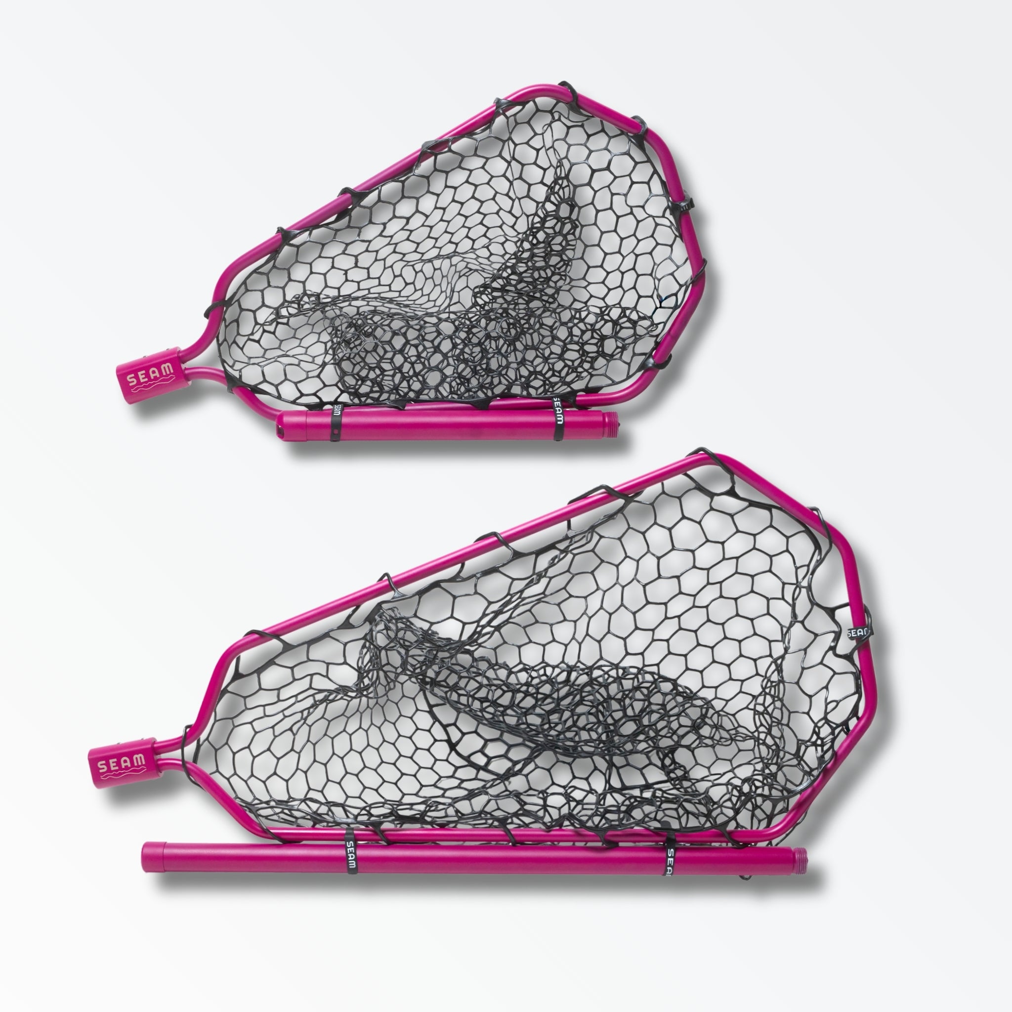 Two different sized bright pink landing nets for fly fishing