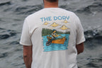 Person wearing a t-shirt with 'The Dory' design by a body of water (global)